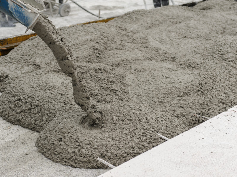 mixed concrete pouring at construction site